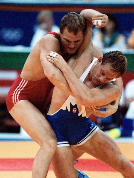 Canada's Steve Marshall (blue) competing in the wrestling event at the 1988 Olympic games in Seoul. (CP PHOTO/ COA/ Cromby McNeil)