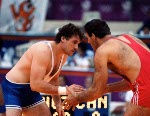 Canada's Jeff Thue (centre) celebrates the silver medal he won in the wrestling event at the 1992 Olympic games in Barcelona. (CP PHOTO/ COA/ Ted Grant)