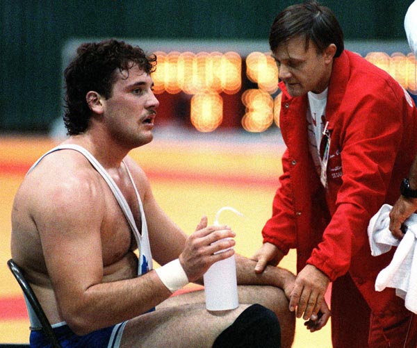 Canada's Dan Payne (left) and coach Louis Kupsic competing in the wrestling event at the 1988 Olympic games in Seoul. (CP PHOTO/ COA/ Cromby McNeil)