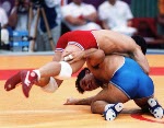 Canada's Chris Rinke (blue) competing in the wrestling event at the 1988 Olympic games in Seoul. (CP PHOTO/ COA/ Cromby McNeil)