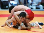 Canada's Chris Rinke (blue) competing in the wrestling event at the 1988 Olympic games in Seoul. (CP PHOTO/ COA/ Cromby McNeil)