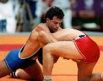 Canada's Chris Rinke (blue) competing in the wrestling event at the 1988 Olympic games in Seoul. (CP PHOTO/ COA/ Cromby McNeil)