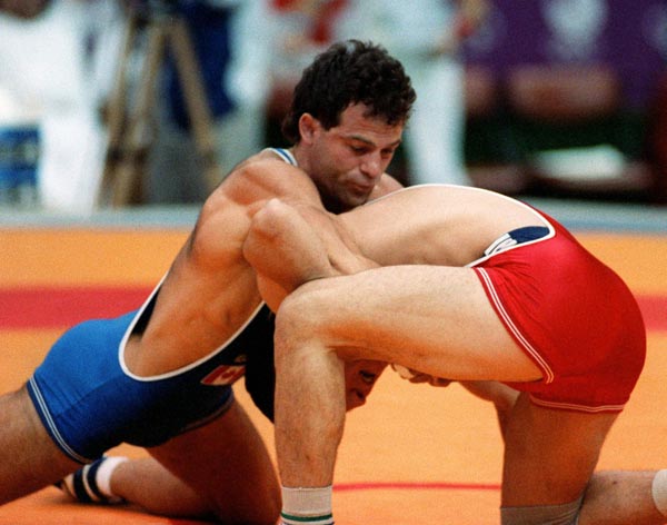 Canada's Chris Rinke (blue) competing in the wrestling event at the 1988 Olympic games in Seoul. (CP PHOTO/ COA/ Cromby McNeil)