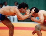 Canada's Chris Rinke (blue) competing in the wrestling event at the 1988 Olympic games in Seoul. (CP PHOTO/ COA/ Cromby McNeil)