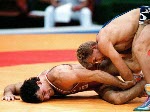 Canada's Chris Rinke (blue) competing in the wrestling event at the 1988 Olympic games in Seoul. (CP PHOTO/ COA/ Cromby McNeil)