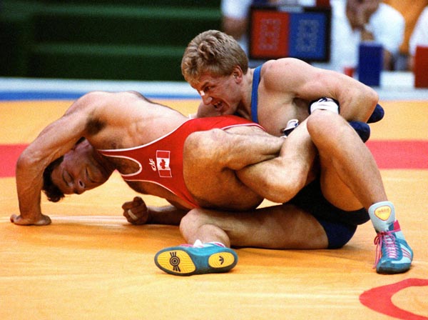 Canada's Chris Rinke (left) competing in the wrestling event at the 1988 Olympic games in Seoul. (CP PHOTO/ COA/ Cromby McNeil)