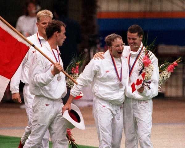 From left; Canada's Sandy Goss, Victor Davis, Tom Ponting and Mark Tewksbury celebrate their silver medal win in the men's IM swimming event at the 1988 Olympic games in Seoul. (CP PHOTO/ COA/ Ted Grant)