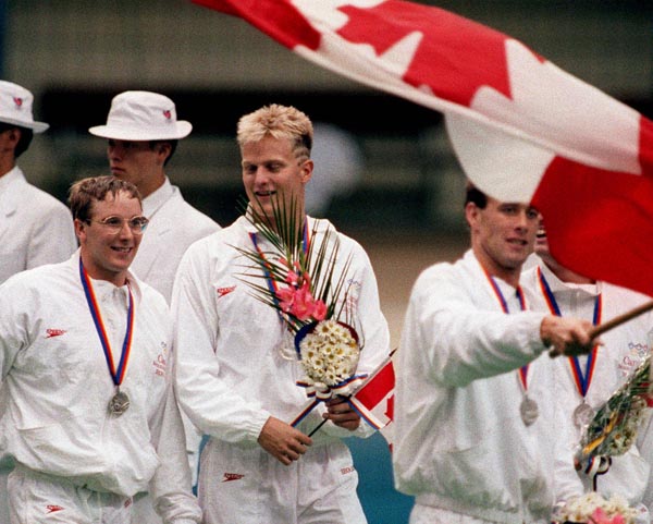 (from left) Canada's Tom Ponting, Sandy Goss and Victor Davis celebrate their silver medal win in the men's IM swimming event at the 1988 Olympic games in Seoul. (CP PHOTO/ COA/ Cromby McNeil)
