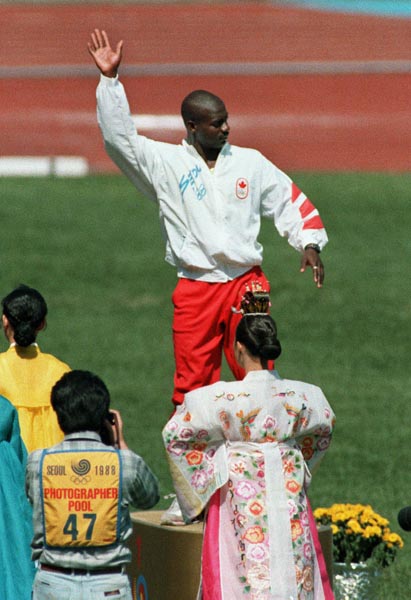 Canada's Ben Johnson celebrates his gold medal win in the 100m race at the 1988 Olympic games in Seoul. (CP PHOTO/ COA/ Cromby McNeil)