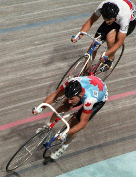 Canada's Gianni Vignaduzzi (red and blue) participating in the cycling event at the 1988 Olympic games in Seoul. (CP PHOTO/ COA/ Cromby McNeil)
