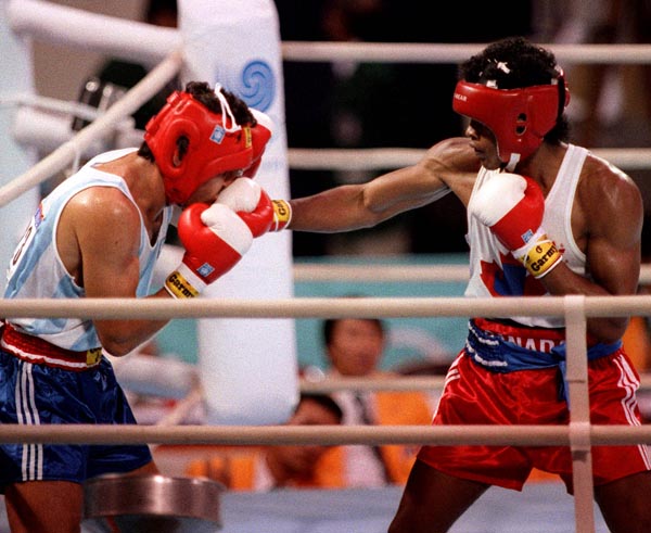 Canada's Raymond Downey (right) competing in the boxing event at the 1988 Olympic games in Seoul. (CP PHOTO/ COA/ S.Grant)