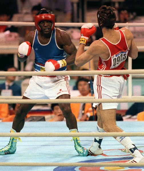 Canada's Egerton Marcus (left) competing in the boxing event at the 1988 Olympic games in Seoul. (CP PHOTO/ COA/ S.Grant)