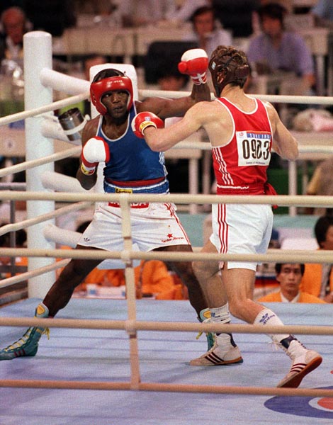 Canada's Egerton Marcus (left) competing in the boxing event at the 1988 Olympic games in Seoul. (CP PHOTO/ COA/ S.Grant)