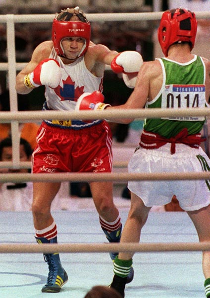 Canada's Scott Olson (left) competing in the boxing event at the 1988 Olympic games in Seoul. (CP PHOTO/ COA/ S.Grant)