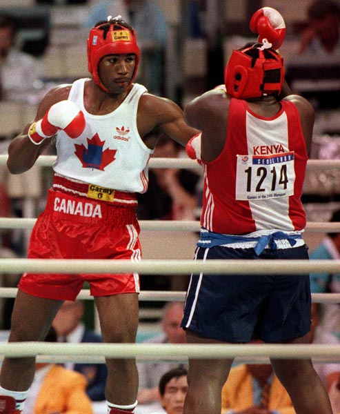 Canada's Lennox Lewis (left) competing in the boxing event at the 1988 Olympic games in Seoul. (CP PHOTO/ COA/ S.Grant)