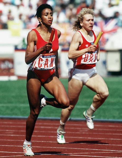 Canada's Charmaine Crooks (left) competing in the 4x400m relay event at the 1988 Olympic games in Seoul. (CP PHOTO/ COA/F.S.Grant)