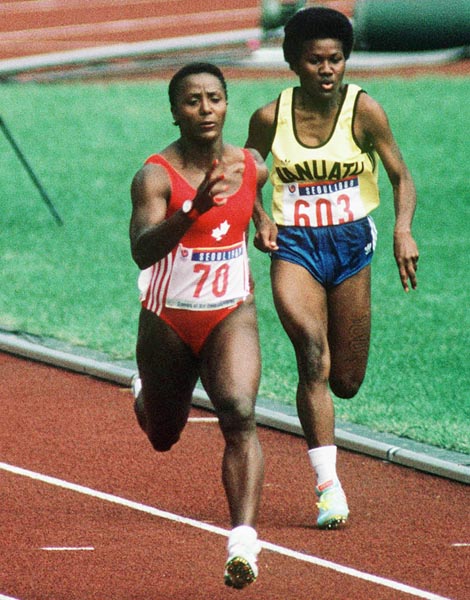 Canada's Angella Issajenko (left) competing in the 100m  event at the 1988 Olympic games in Seoul. (CP PHOTO/ COA/F.S.Grant)