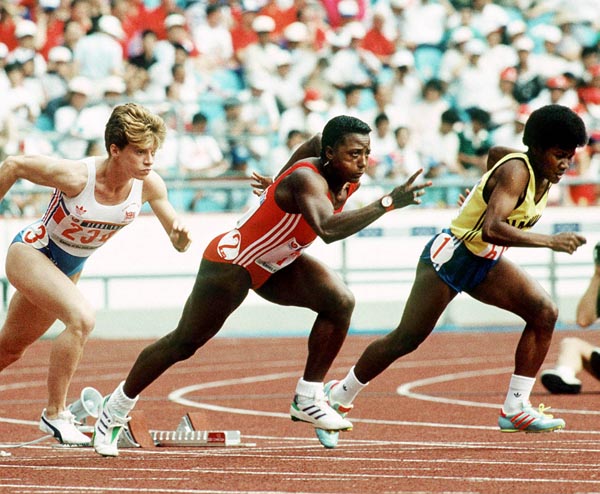 Canada's Angella Issajenko (centre) competing in the 100m  event at the 1988 Olympic games in Seoul. (CP PHOTO/ COA/F.S.Grant)
