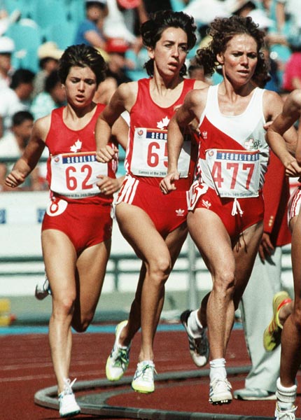 Canada's Debbie Bowker (left) and Angela Chalmers (centre) competing in the 1500m event at the 1988 Olympic games in Seoul. (CP PHOTO/ COA/F.S.Grant)
