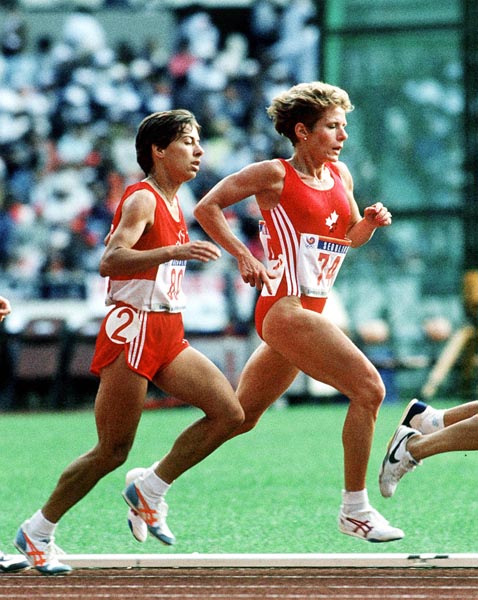 Canada's Carole Rouillard (left) and Sue Lee (left) competing in the 10 000m event at the 1988 Olympic games in Seoul. (CP PHOTO/ COA/F.S.Grant)