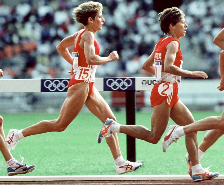 Canada's Sue Lee (left) and Carole Rouillard competing in the 10 000m event at the 1988 Olympic games in Seoul. (CP PHOTO/ COA/F.S.Grant)