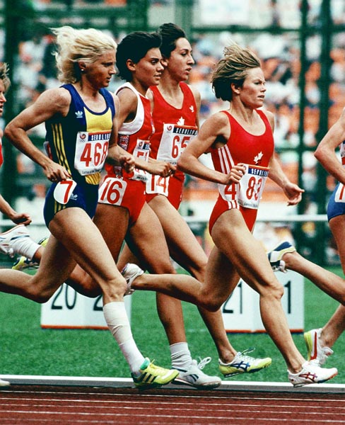 Canada's Angela Chalmers (#65) and Lynn Williams (#83) competing in the 3000m  event at the 1988 Olympic games in Seoul. (CP PHOTO/ COA/F.S.Grant)