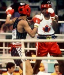 Canada's Ray Downey (left) in action against his opponent Si-Hun Park from Korea at the 1988 Olympic Games in Seoul. (CP Photo/ COA/F.S.Grant)