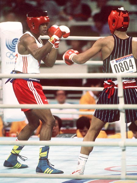 Canada's Ray Downey (left) in action against his opponent Si-Hun Park from Korea at the 1988 Olympic Games in Seoul. (CP Photo/ COA/F.S.Grant)