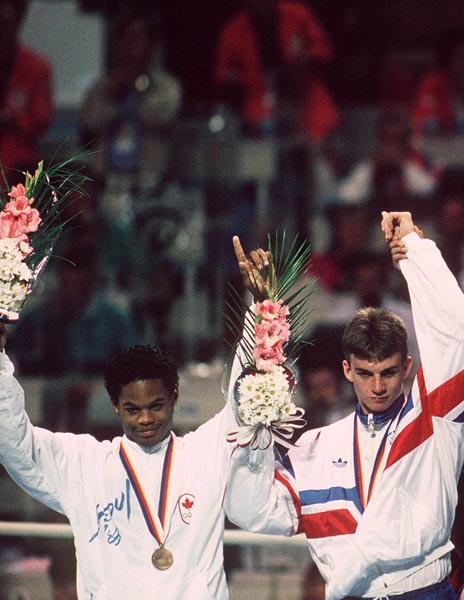 Canada's Ray Downey (left) celebrates after winning the bronze medal in the boxing event at the 1988 Olympic Games in Seoul. (CP Photo/ COA/S.Grant)