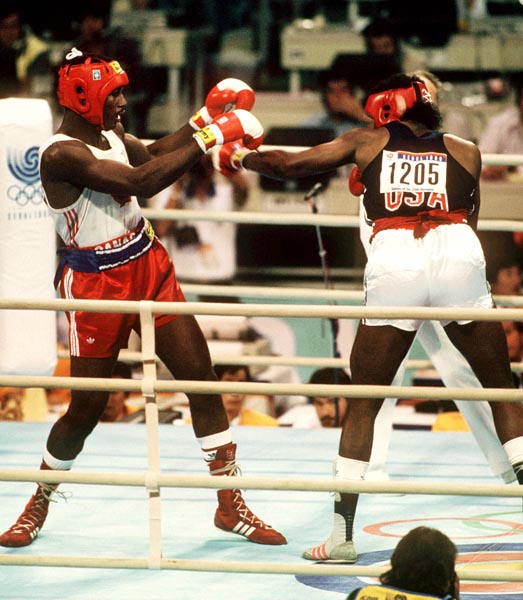 Canada's Lennox Lewis (left) in action against his opponent Riddick Bowe from the United States at the 1988 Olympic Games in Seoul. (CP Photo/ COA/S.Grant)