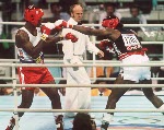 Canada's Lennox Lewis (right) in action against his opponent Riddick Bowe from the United States at the 1988 Olympic Games in Seoul. (CP Photo/ COA/S.Grant)