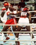 Canada's Lennox Lewis (right) in action against his opponent Riddick Bowe from the United States at the 1988 Olympic Games in Seoul. (CP Photo/ COA/S.Grant)