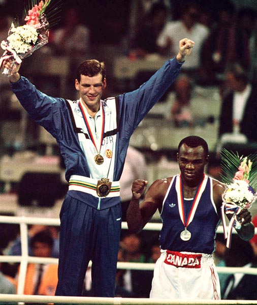 Canada's Egerton Marcus (right) celebrates his silver medal win in the boxing event at the 1988 Olympic games in Seoul. (CP PHOTO/ COA/ Cromby McNeil)