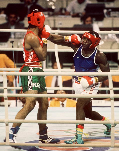 Canada's Egerton Marcus (right) competing in the boxing event at the 1988 Olympic games in Seoul. (CP PHOTO/ COA/ S.Grant)