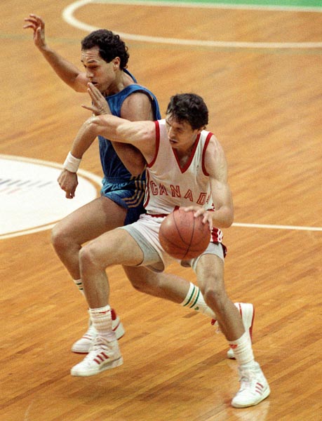 Canada's Eli Pasquale (right) competing in the basketball event at the 1988 Olympic games in Seoul. (CP PHOTO/ COA/ S. Grant)