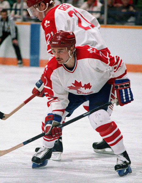 Canada's Wallace Schreiber (#7) and Randy Gregg (#21) participate in the hockey event at the 1988 Winter Olympics in Calgary. (CP PHOTO/COA/S.Grant)