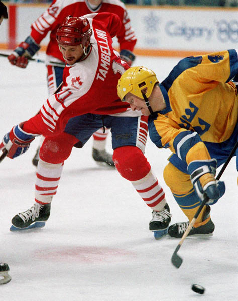 Canada's Steven Tambellini (#11) participates in the hockey event at the 1988 Winter Olympics in Calgary. (CP PHOTO/COA/S.Grant)
