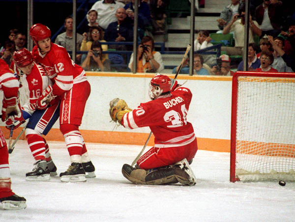 Canada's Merlin Malinowski (#16) participates in the hockey event at the 1988 Winter Olympics in Calgary. (CP PHOTO/COA/S.Grant)