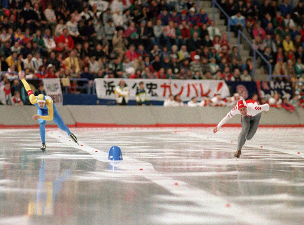 Canada's Marcel Tremblay (right) participates in the speedskating event at the 1988 Winter Olympics in Calgary. (CP PHOTO/COA/T. O'lett)