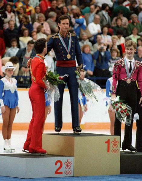 Canada's Brian Orser (left) celebrates his silver medal win in the men's figure skating event along with gold medal winner Brian Boitano from the U.S.A. (centre) and bronze medal winner Victor Petrenko from Russia  at the 1988 Winter Olympics in Calgary.