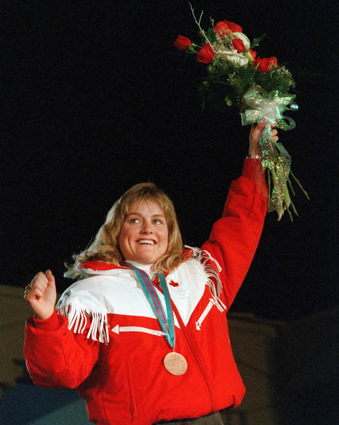 Canada's Karen Percy celebrates her bronze medal win in the alpine ski event at the 1988 Winter Olympics in Calgary. (CP PHOTO/ COA/C. McNeil)