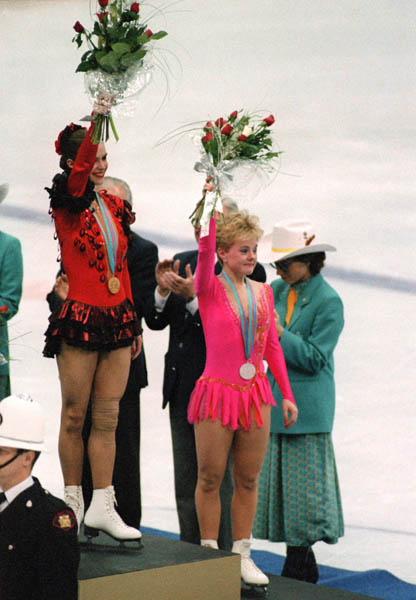 Canada's Elizabeth Manley (right) celebrates her silver medal win in the figure skating event along with gold medalist Katarina Witt of East Germany in the figure skating event at the 1988 Winter Olympics in Calgary. (CP PHOTO/COA/ C. McNeil)