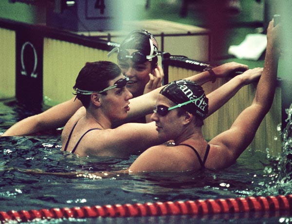 Canada's Donna McGinnis (in front) competing in the swimming event at the 1988 Olympic games in Seoul. (CP PHOTO/ COA/ Cromby McNeil)
