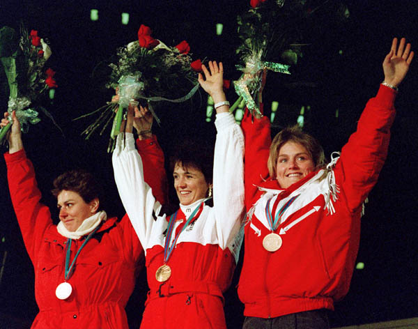 Canada's Karen Percy (right) celebrates her bronze medal win in the alpine ski event at the 1988 Winter Olympics in Calgary. (CP PHOTO/ COA/S. Grant)