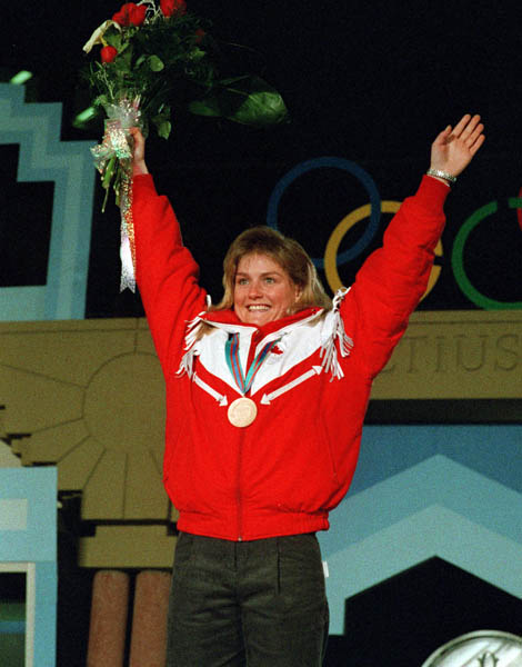 Canada's Karen Percy celebrates her bronze medal win in the alpine ski event at the 1988 Winter Olympics in Calgary. (CP PHOTO/ COA/S. Grant)