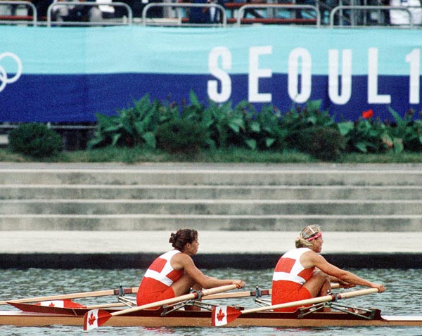 Canada's Kay Worthington (left) and Silken Laumann competing in the rowing event at the 1988 Olympic games in Seoul. (CP PHOTO/ COA/ Cromby McNeil)