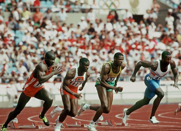 Canada's Ben Johnson (left) competes in the 100m event at the 1988 Olympic games in Seoul. (CP PHOTO/ COA/ C. McNeil)