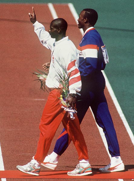 Canada's Ben Johnson (left) celebrates his gold medal win in the 100m final along with bronze medal winner Linford Christie at the 1988 Olympic games in Seoul. (CP PHOTO/ COA/ Cromby McNeil)