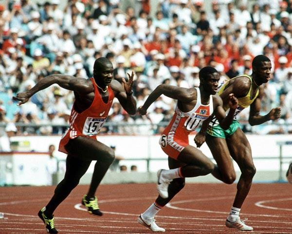 Canada's Ben Johnson (left) competes in the 100m event at the 1988 Olympic games in Seoul. (CP PHOTO/ COA/ Cromby McNeil)