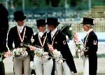 (Right to left) Canada's Cindy Ishoy, and Gina Smith celebrate their bronze medal win with gold medal winners Team France in the equestrian-dressage event at the 1988 Olympic games in Seoul. (CP PHOTO/ COA/ C. McNeil)